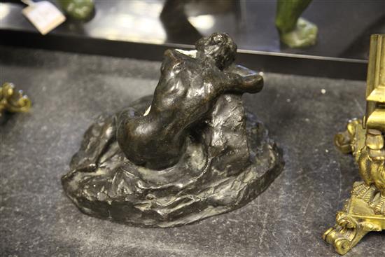 John Tweed (British, 1869-1933). A patinated bronze model of a recumbent female nude, 9.5in.